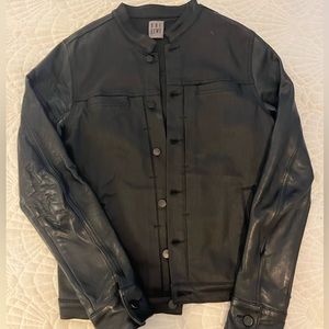 One BXWD black denim jacket with leather sleeves.